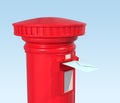 Red British postbox on blue background