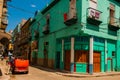 Red broken car. Street scene with classic old cars and traditional colorful buildings in downtown Havana. Cuba Royalty Free Stock Photo