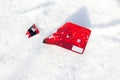 Broken credit card on snow background