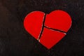 Red broken heart against a dark background Royalty Free Stock Photo