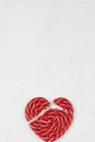 Red broken heart as lollipop candy. Valentines day minimalist background. love symbol, space for text concept Royalty Free Stock Photo