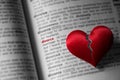 Red broken heart on dictionary divorce definition. The concept of divorce, parting, infidelity . Selective focus Royalty Free Stock Photo