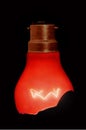 Red broken lightbulb