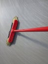 Red broom sweeping Royalty Free Stock Photo