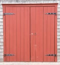 Red Brown Barn Doors to old farm structure Royalty Free Stock Photo