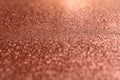 Red brown blurred background with fine texture of shiny crystals