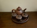 Red brown ceramic clay tea pot and cups Royalty Free Stock Photo