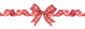Curly red and brown gingham plaid Christmas gift bow and ribbon isolated on white