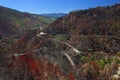 Red, brown and green coloured landscape at Gois in Portugal after wildfire, near Coimbra