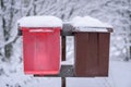 The red and brown mailbox has covered with heavy snow in winter season at Lapland, Finland Royalty Free Stock Photo