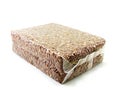 Red brown rice in vacuum package on white background