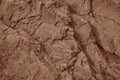 Light red brown rock texture. Cracked layered mountain surface. Close-up. Grungy stone background Royalty Free Stock Photo