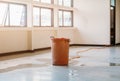 Red bucket underlie water leak interior office building in from Ceiling Royalty Free Stock Photo
