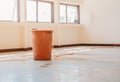 Red bucket underlie water leak interior office building in from Ceiling Royalty Free Stock Photo