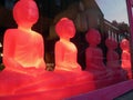 Red buddhas in shop window