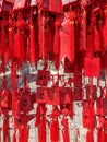 Red buddhists praying and hanging traditional wishing cards