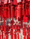 Red buddhists praying and hanging traditional wishing cards