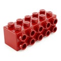 Red Building Block Toy with Multiple Studs and Holes Isolated on White Background plastic Royalty Free Stock Photo