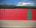 Red building with green door