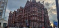 Red building standing tall in the heart of Manchester.