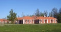 Red buildings near Rundale Palace , Latvia Royalty Free Stock Photo