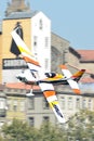 Juan Velarde plane flying against historic buildings background