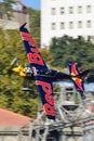 Kirby Chambliss plane flying against buildings background