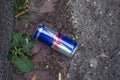Red bull can abandonned in the street