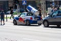 Red Bull Mini Cooper car with logo. mini cooper with a red bull branding decoration and a red bull can on the roof