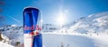 Red Bull is the most popular energy drink in the world in Aluminum can of red bull in the winter mountains background.