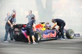 Red Bull Racing pit crews cooling F1 car