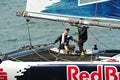 Red Bull Sailing Team skipper steering boat at Extreme Sailing Series Singapore 2013
