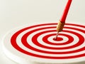 Red bullseye dart arrow hitting target center of dartboard. Concept of success, target, goal, achievement. Royalty Free Stock Photo