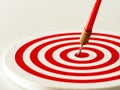 Red bullseye dart arrow hitting target center of dartboard. Concept of success, target, goal, achievement.