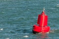 A red buoy floating on water Royalty Free Stock Photo