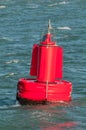 A red buoy floating on water Royalty Free Stock Photo