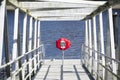 Red buoy life safety ring at boat marina Royalty Free Stock Photo