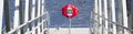 Red buoy life safety ring at boat marina Royalty Free Stock Photo