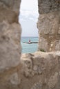 Red buoy in the ocean from a unique castle in Croatia