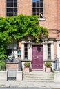 A red burgundy door in Dublin, Ireland. Arched Georgian door house front Royalty Free Stock Photo