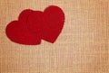 Red Burlap Love Hearts on a Brown Burlap Background Royalty Free Stock Photo