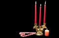 Red burning candles on a black background. Royalty Free Stock Photo