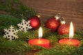 Red Burning Candles with Christmas Decoration Royalty Free Stock Photo