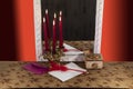 Red burning candles are reflected in the mirror. Royalty Free Stock Photo