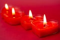 Red burning heart-shaped candles blazing flames. Tongues of fire Valentine's Day Royalty Free Stock Photo
