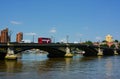 Red bus on Battersea Bridge, London, UK