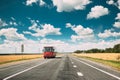 Red Bus In Motion On Country Road. Motion Cars On Freeway In Europe. Asphalt Freeway, Motorway, Highway Through Fields