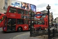 Red bus in Piccadilly Circus in central London city , England Royalty Free Stock Photo