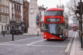red bus routemaster on a London street