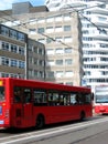 Red bus and tram line